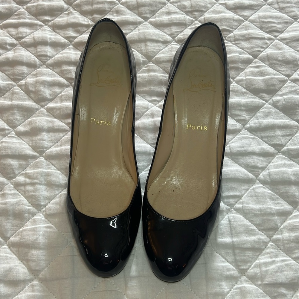 Christian Louis Vuitton red bottoms  Used but good condition